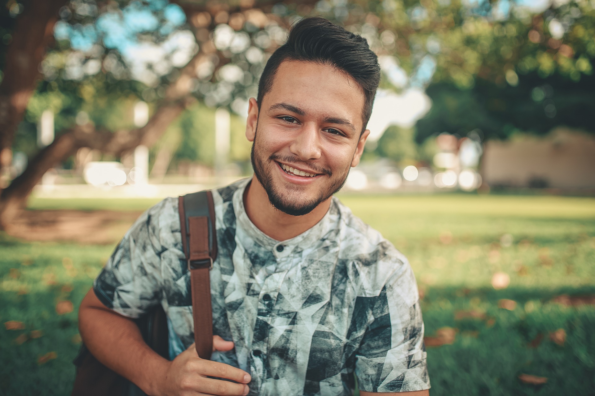 Teen outside with backpack