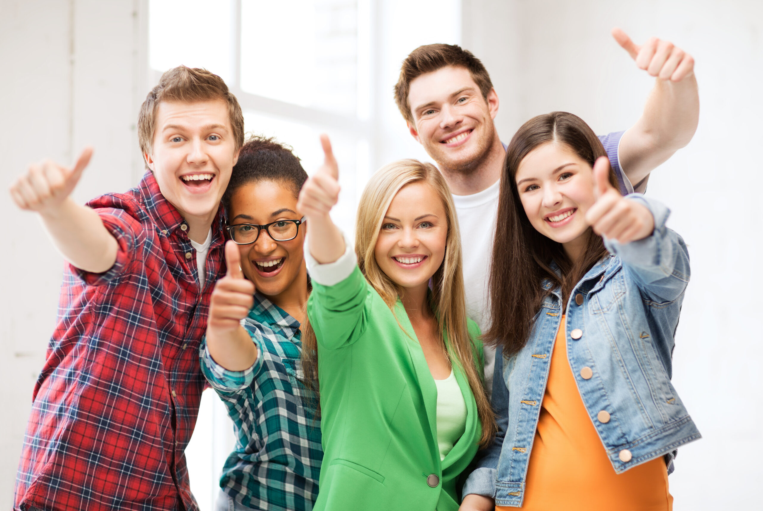 students showing thumbs up at school