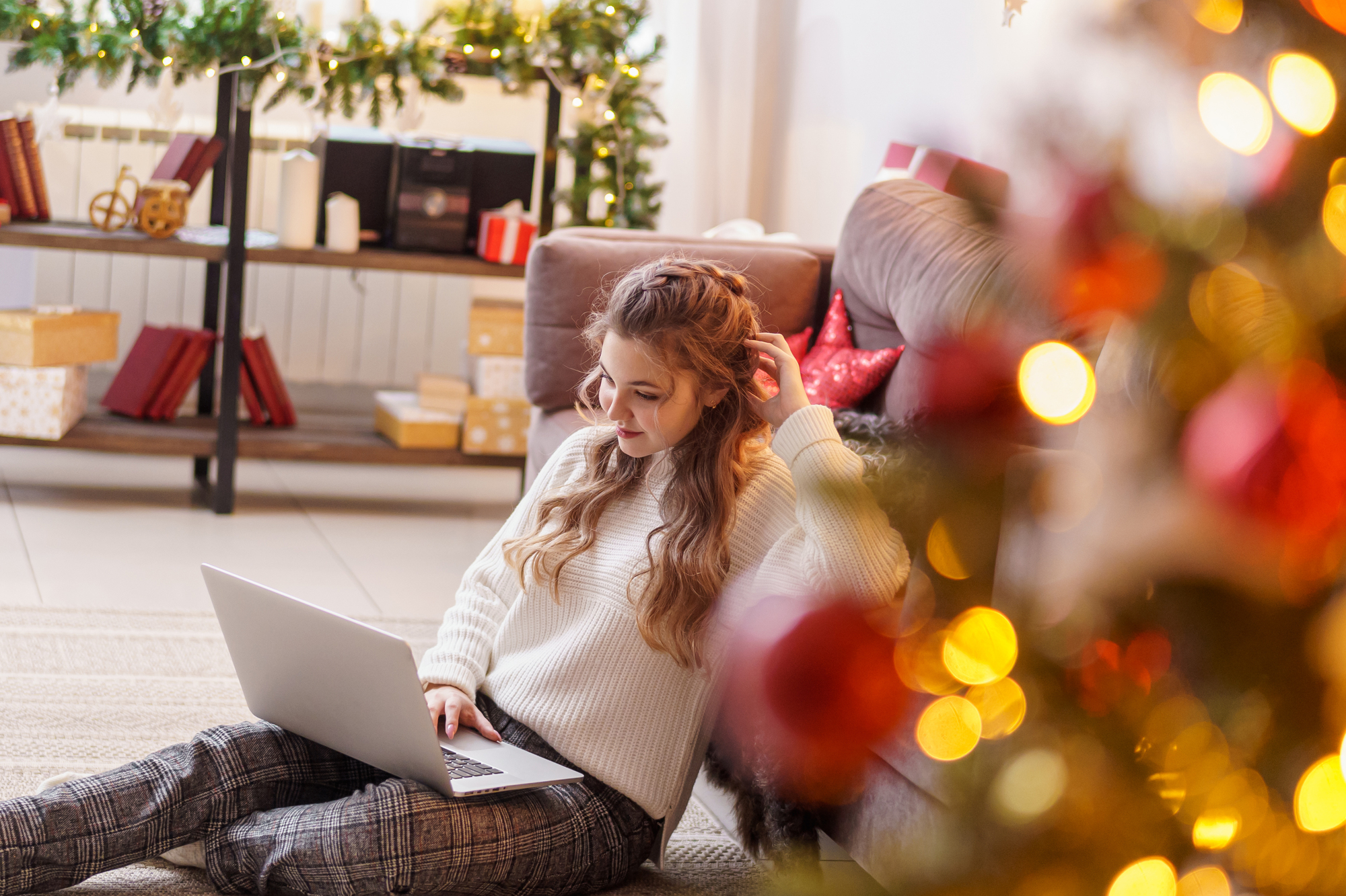 Girl sitting on the floor with her laptop
