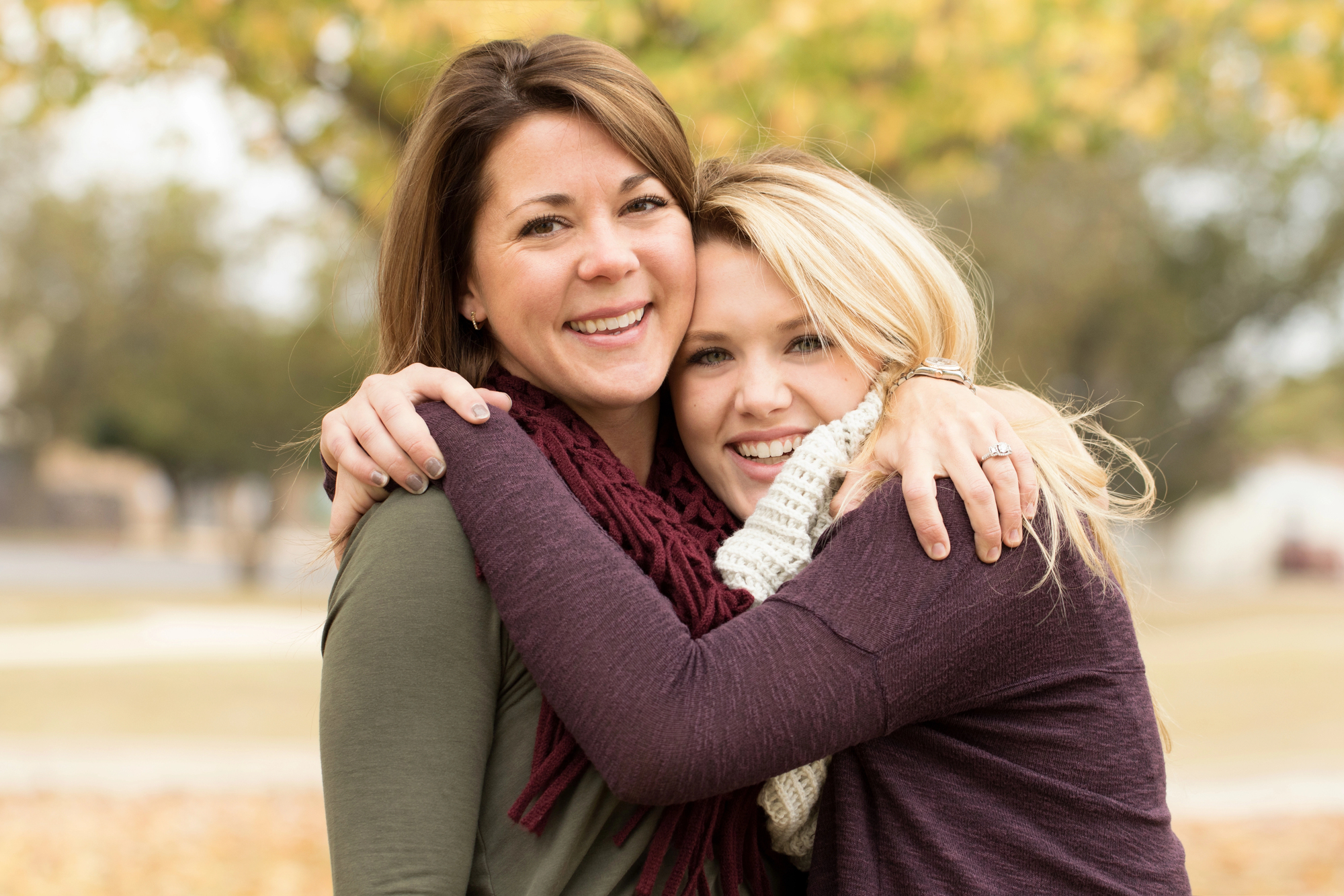 Mother and daughter hugging each other