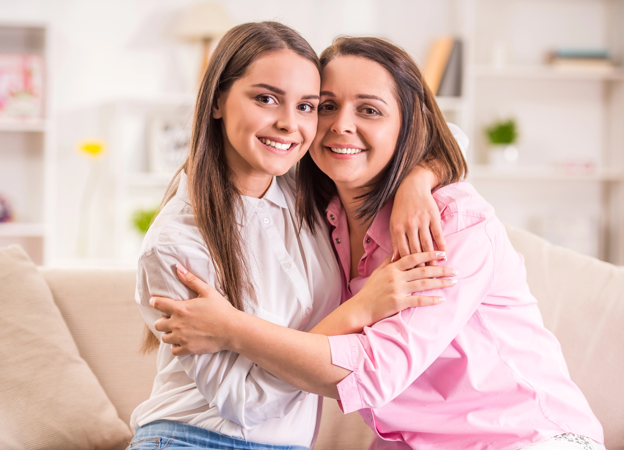 Mother and daughter hugging