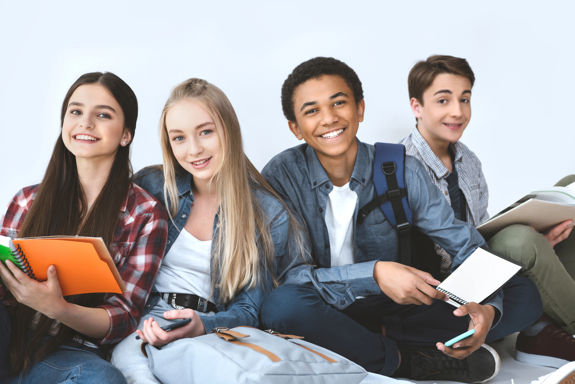 Group of teens sitting together.