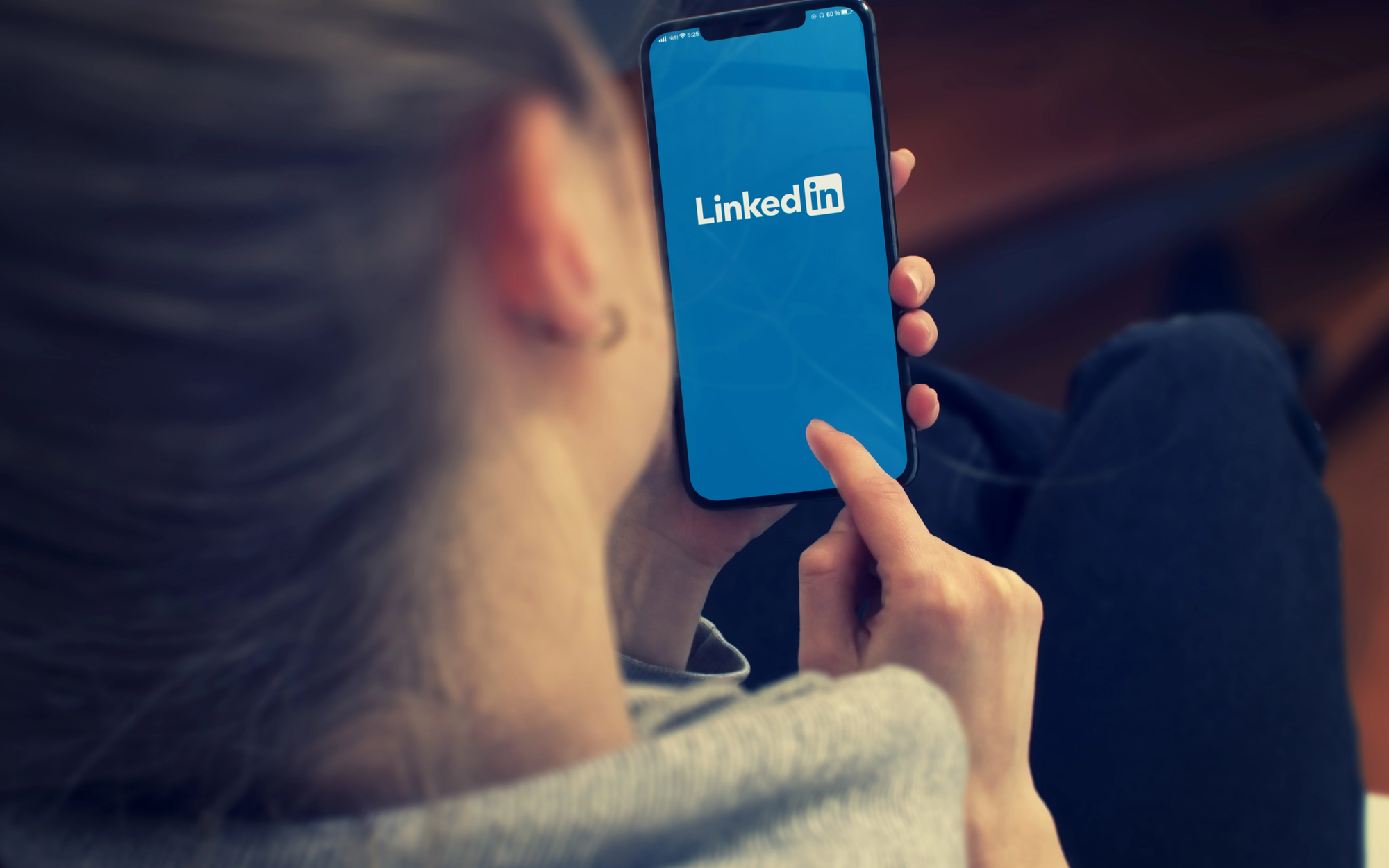 High school student using the LinkedIn app on a smartphone