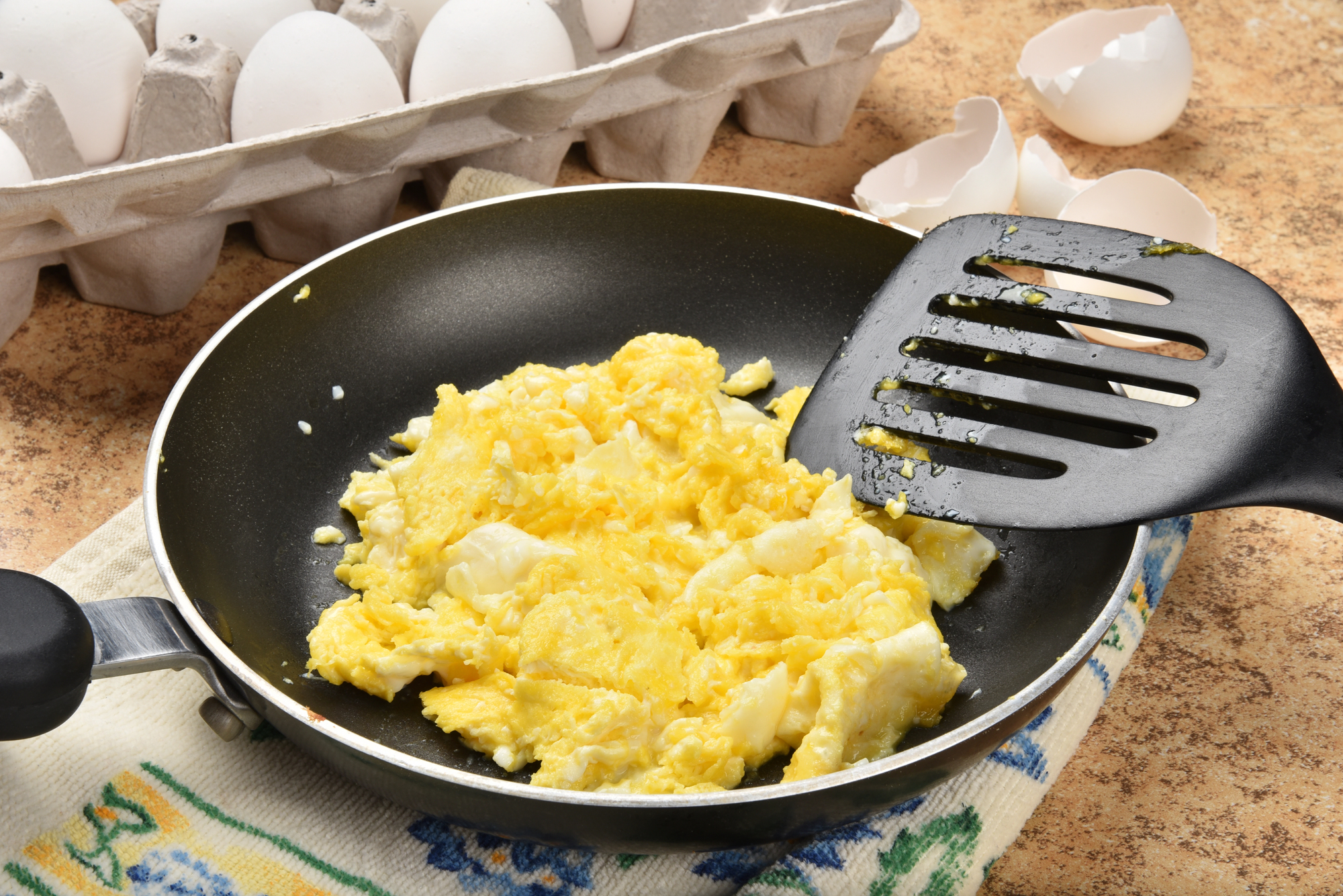 Scrambled eggs in a skillet—an illustration of the “Senior Year Scramble” in college planning.