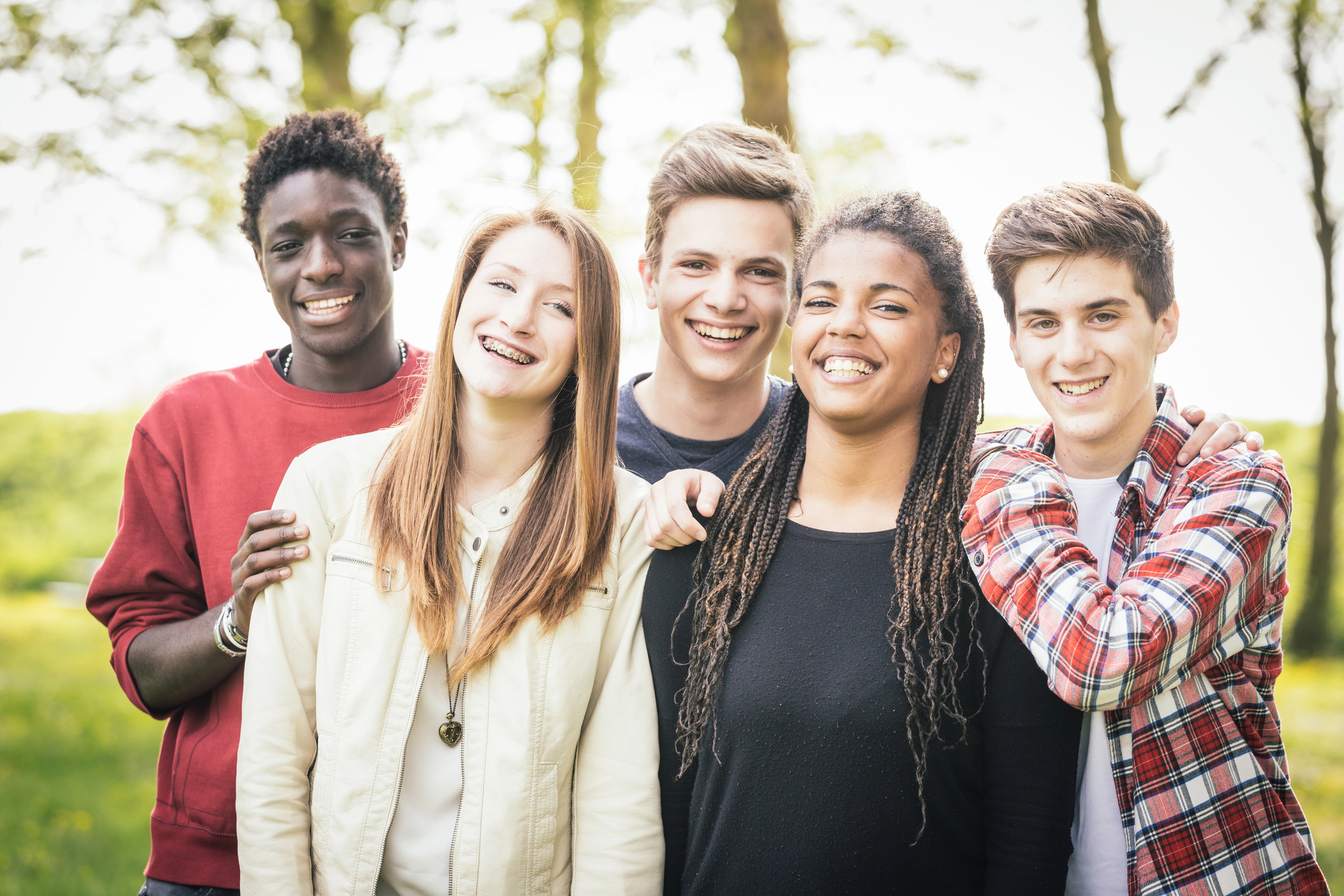 Group of teens standing together outside